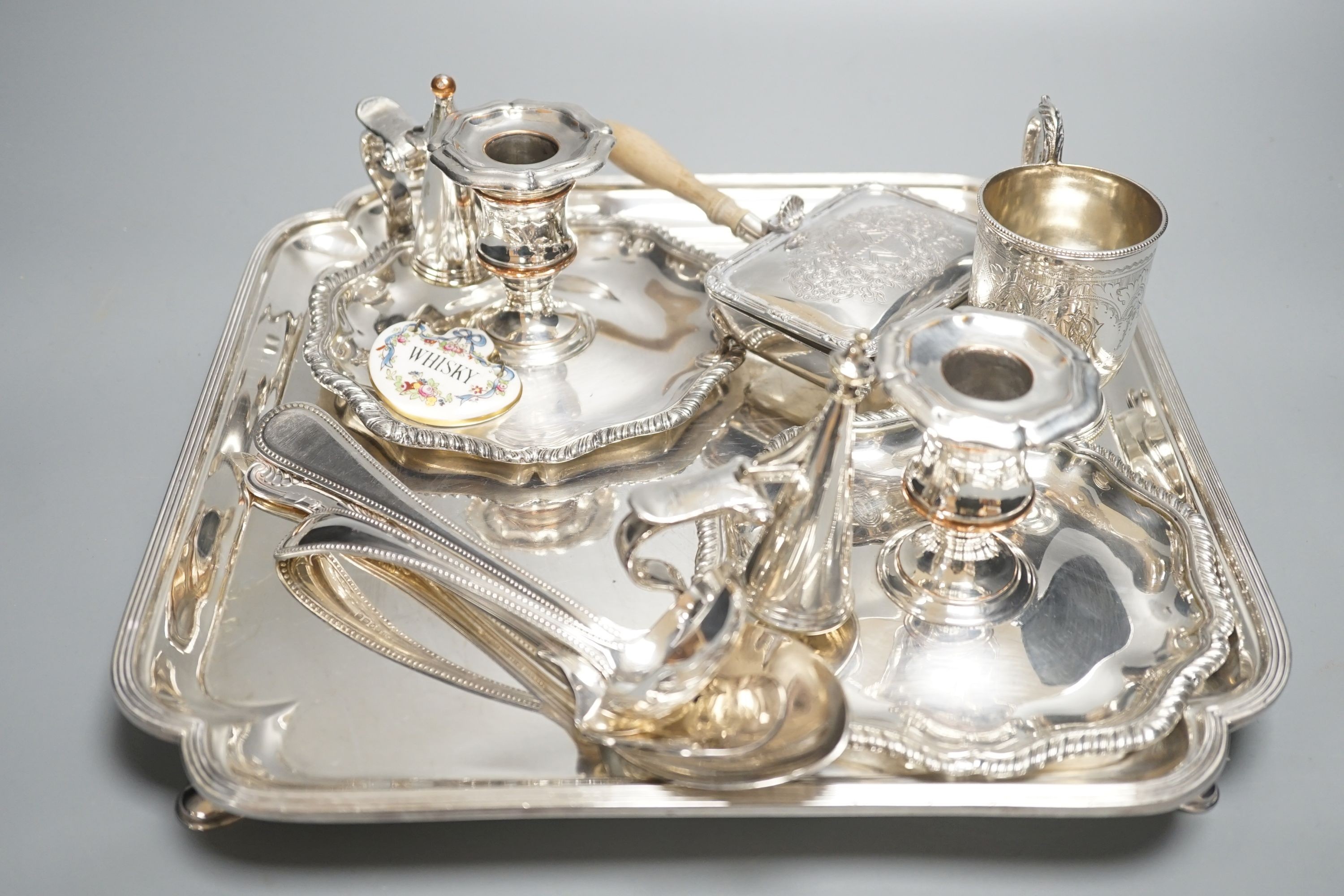 A plated salver, a pair of chambersticks and other plated flatwares